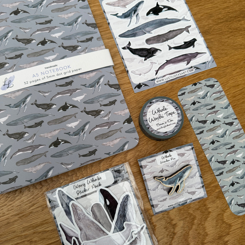 A collection of stationery that makes up a whale bundle sold at discount