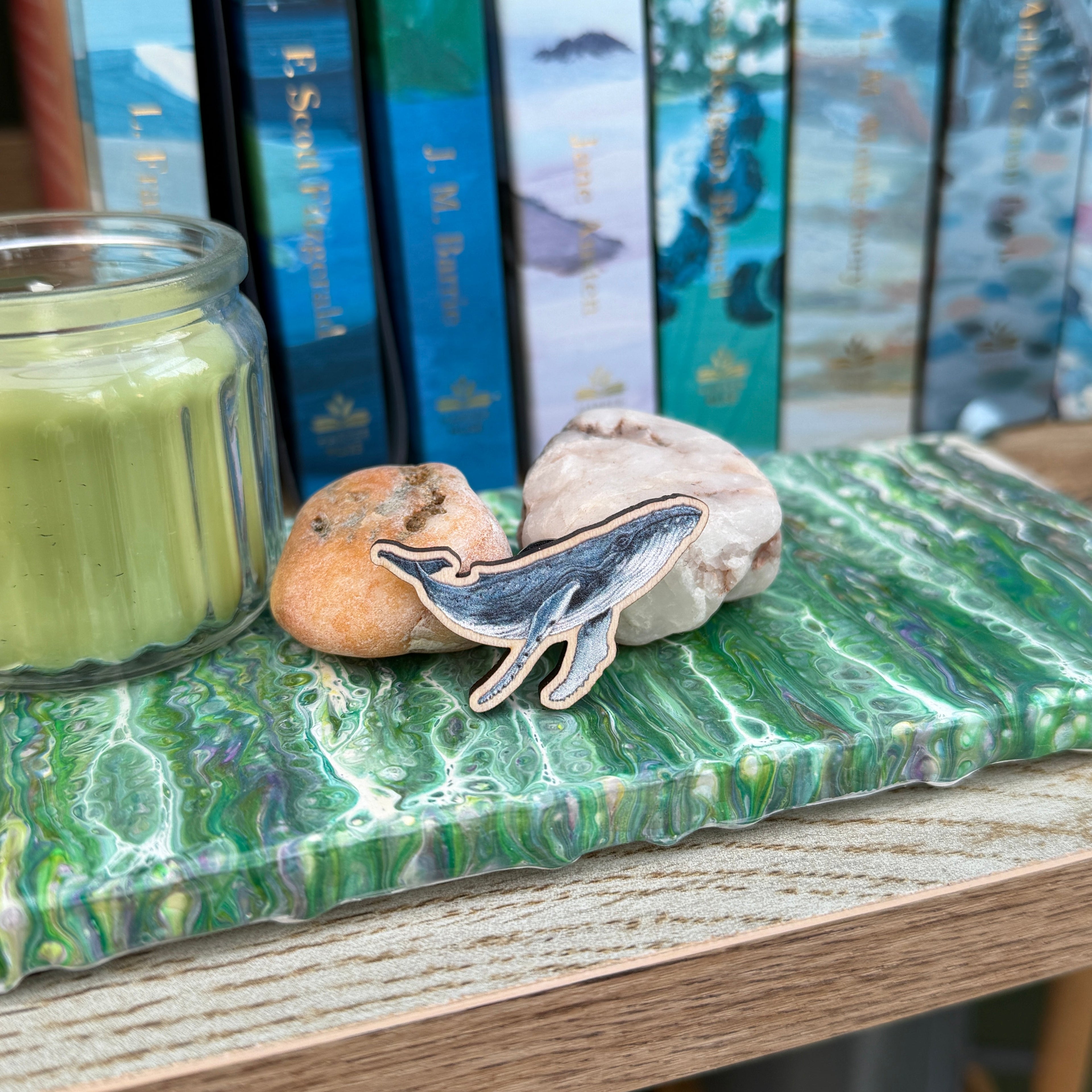 Close-up of a wooden Humback Whale pin